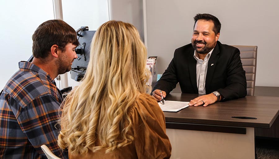 A First Metro Bank Mortgage Officer with Customers