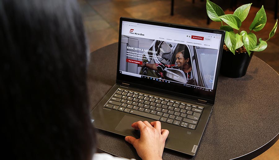 First Metro Bank Employee on a Laptop Computer