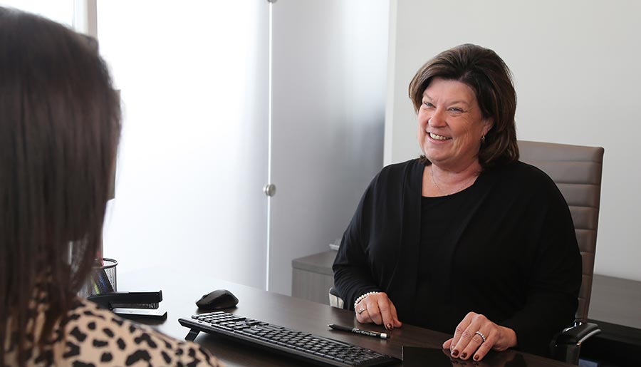 A First Metro Bank Employee with a Customer