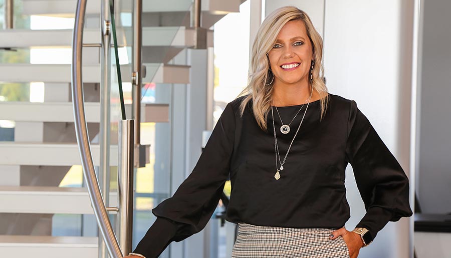 Blonde woman standing on stairs